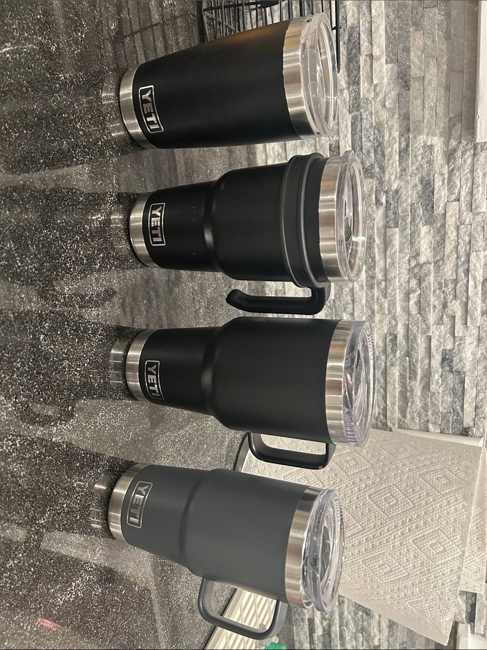 yeti lot - 4 coffee mugs - all with lids and 1 with accessory handle -black gray
